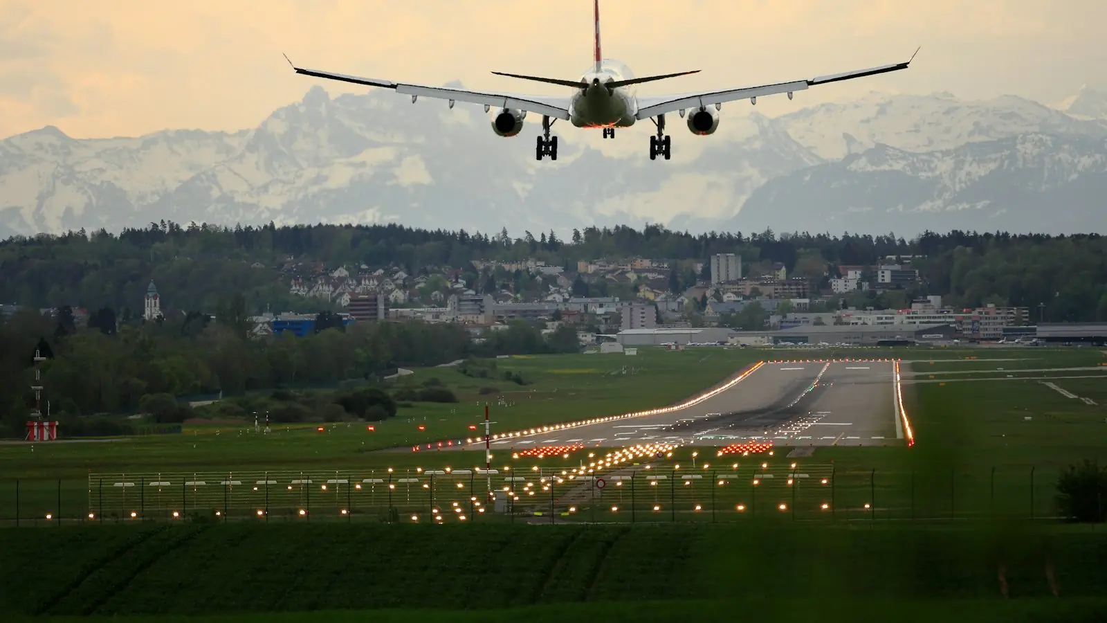 Aeroplane taking off at sunset