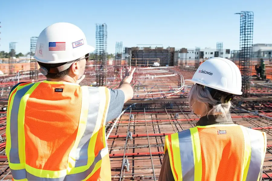 Construction workers in hard hats on site