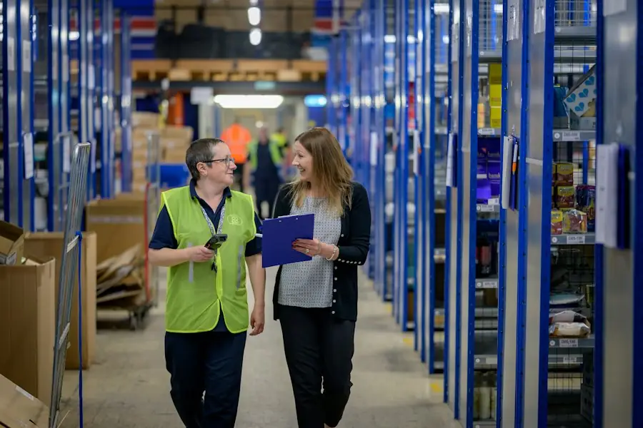 Warehouse staff in high-visibility vests